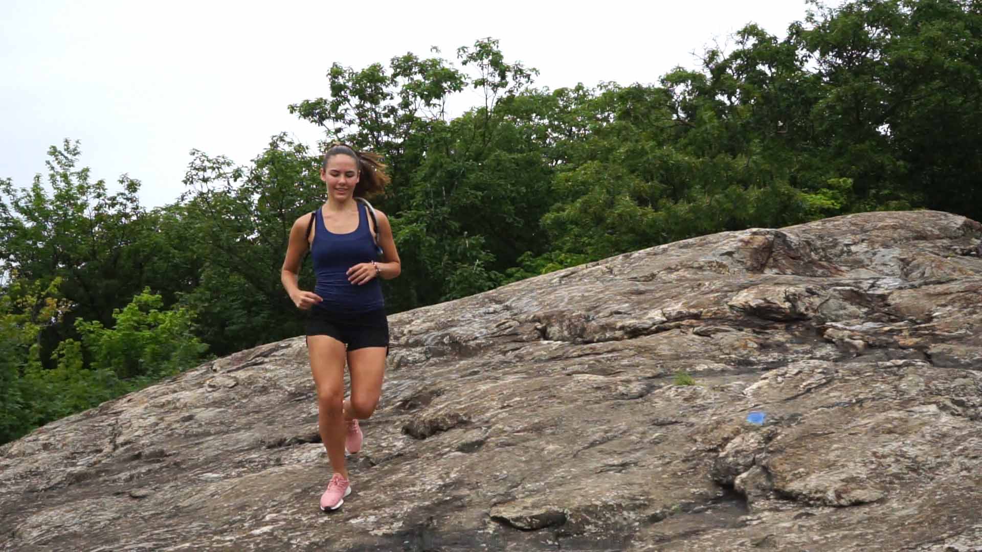 Runner descending a rocky trail